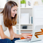 young woman online learning with laptop